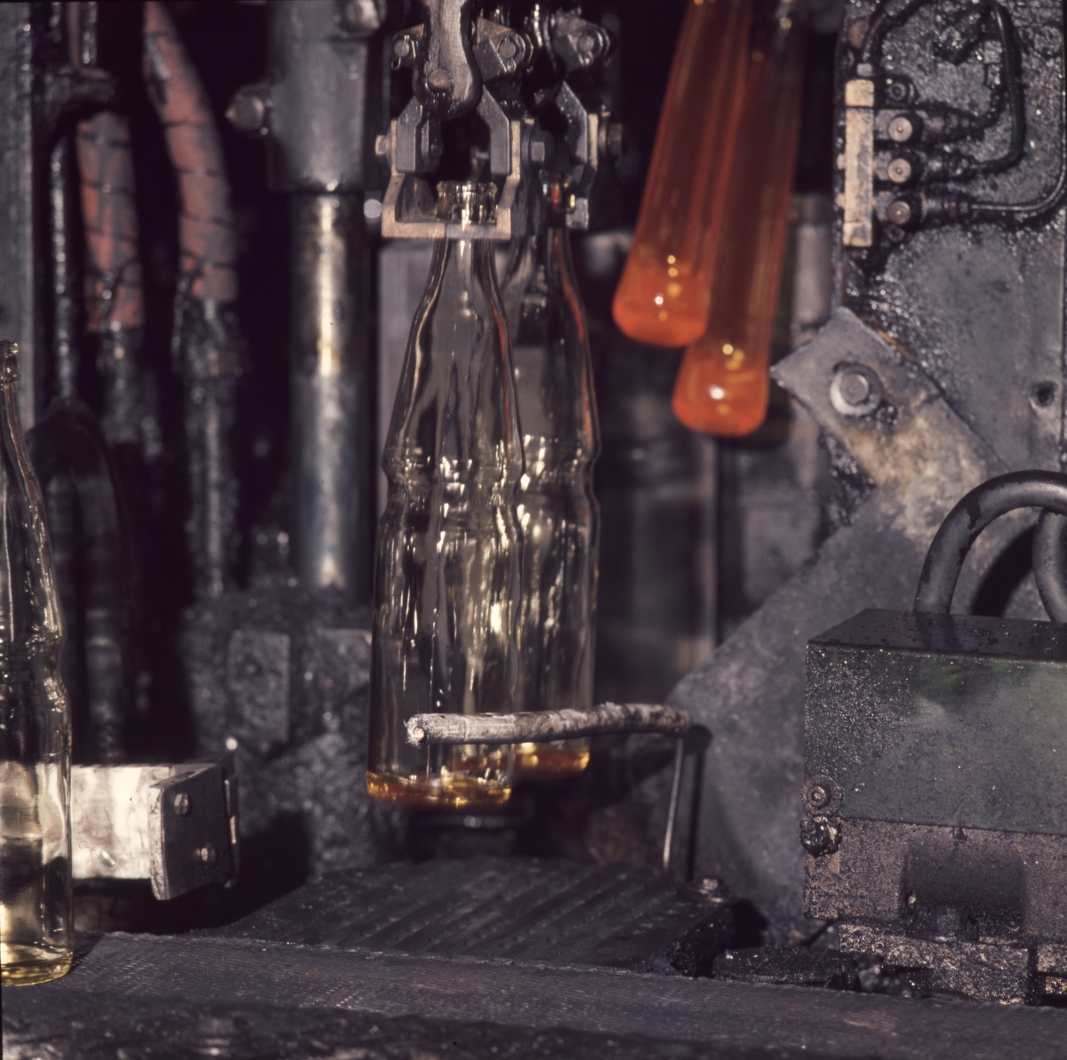 Florida Memory Closeup view showing Coca Cola bottles being made by