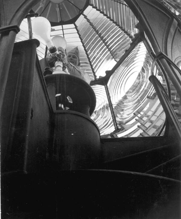 Florida Memory Interior view showing lighthouse keeper with bulbs