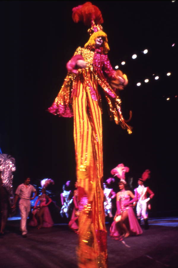 Florida Memory View showing clown walking on stilts during
